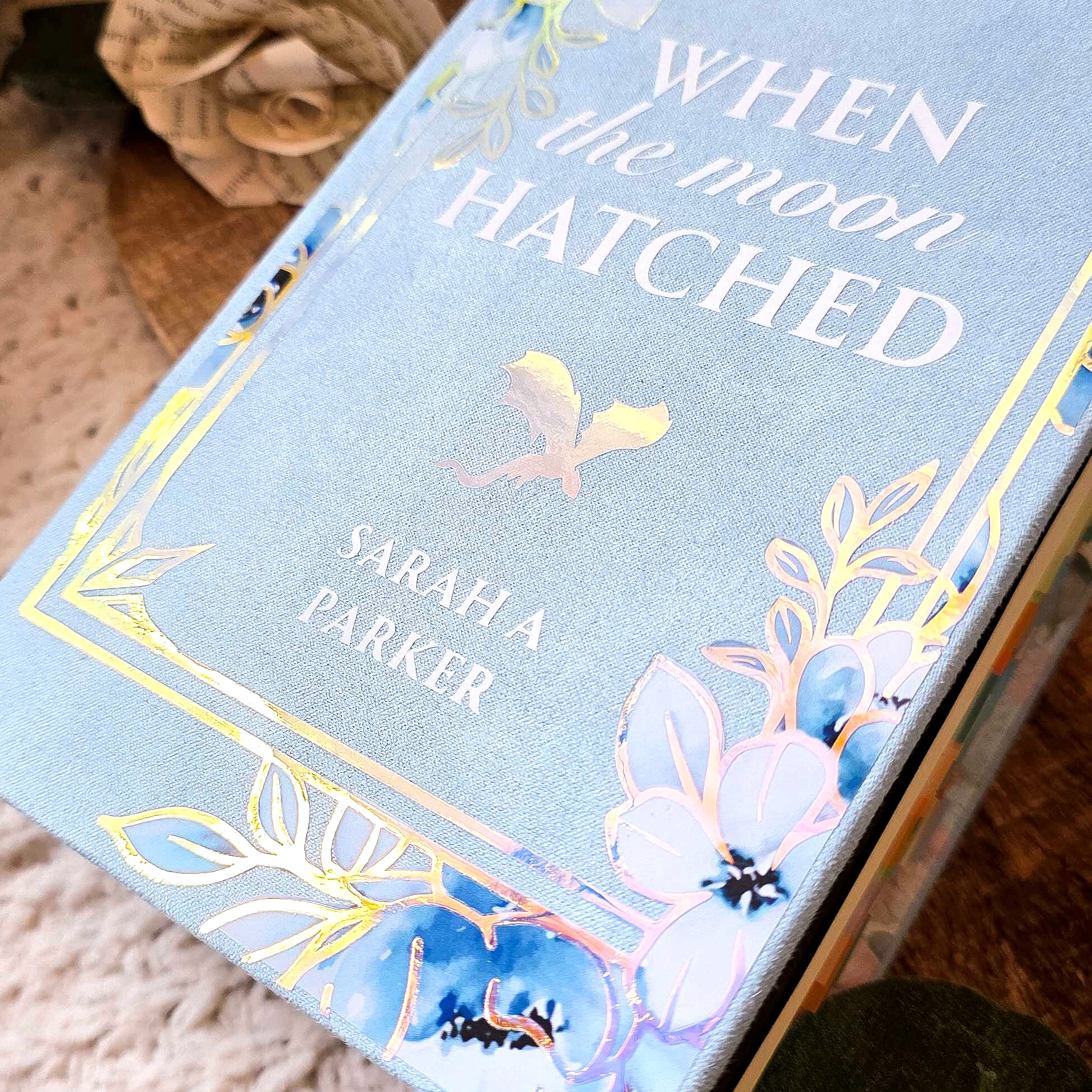 Close-up of floral bookcloth on custom When the Moon Hatched hardcover