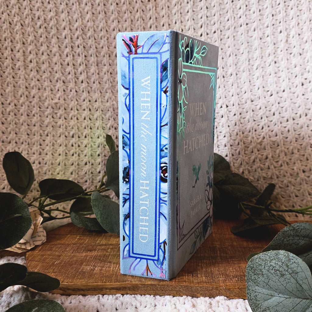 Spine detail of When the Moon Hatched rebound with holographic lettering