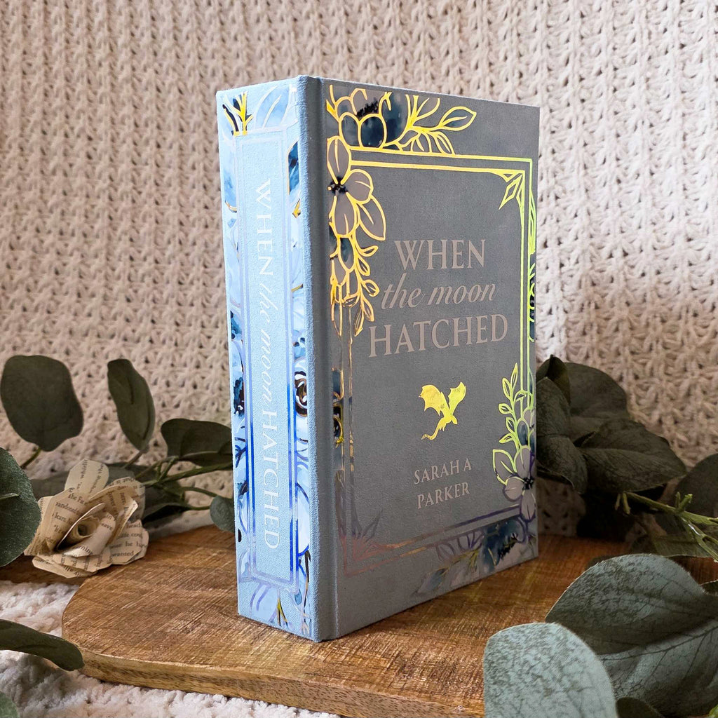 Front cover of floral When the Moon Hatched rebound with holographic foil title